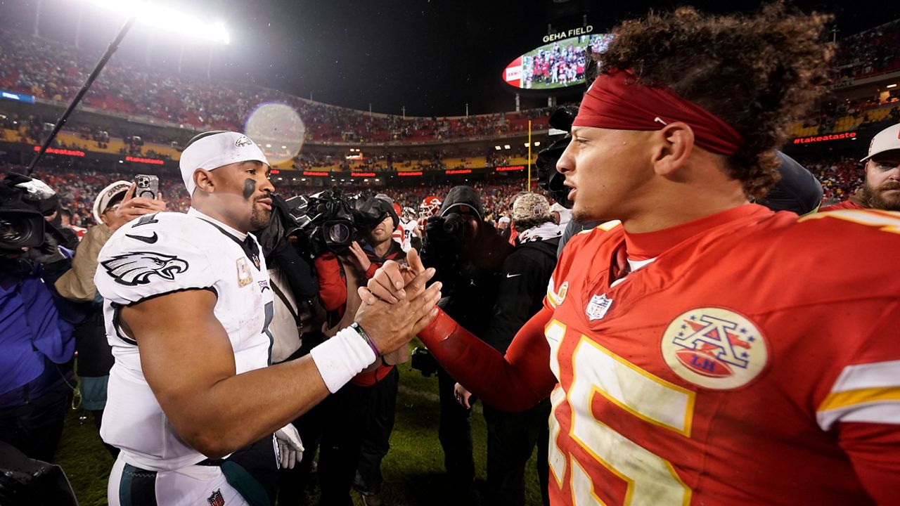 Philadelphia Eagles quarterback Jalen Hurts, left, and Kansas City Chiefs quarterback Patrick Mahomes (15) shake hands following an NFL football game on Monday, Nov. 20, 2023, in Kansas City, Mo. The Eagles won 21-17. (AP Photo/Charlie Riedel)