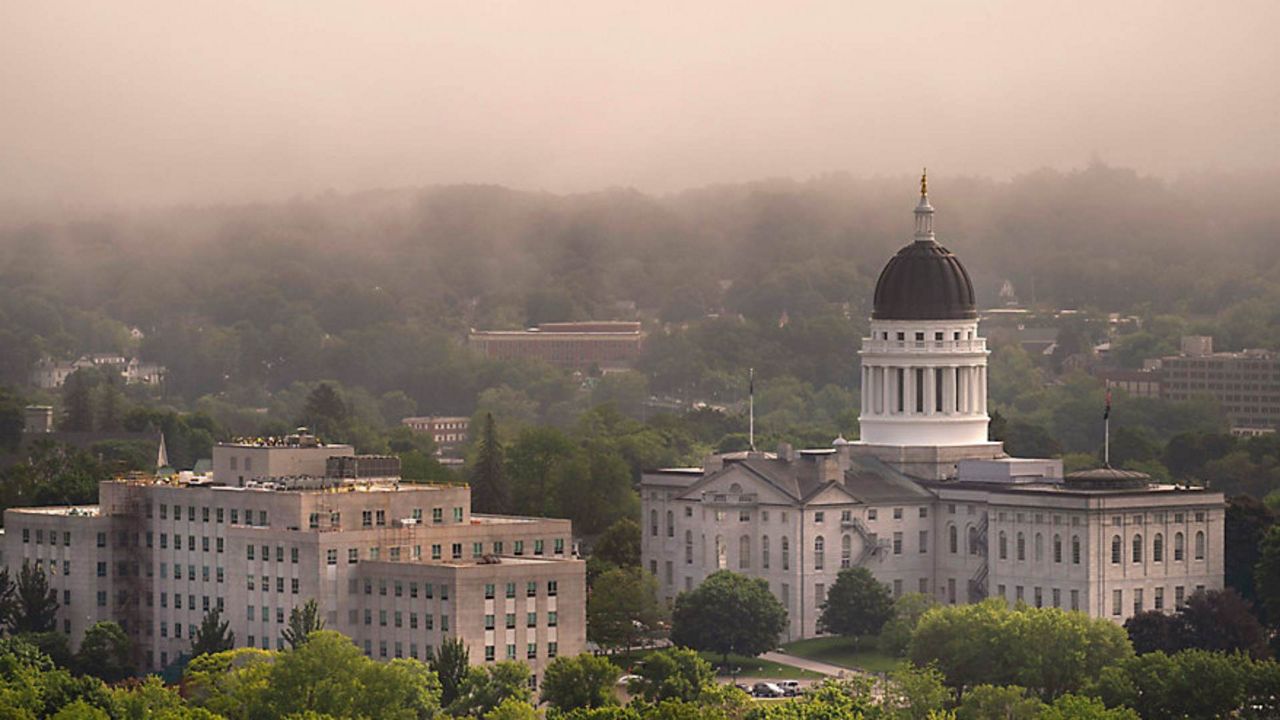 The morning fog lifts beyond the Burton M. Cross Building, left, and the State House, Wednesday, June 21, 2023, in Augusta, Maine. (Associated Press/Robert F. Bukaty, File)