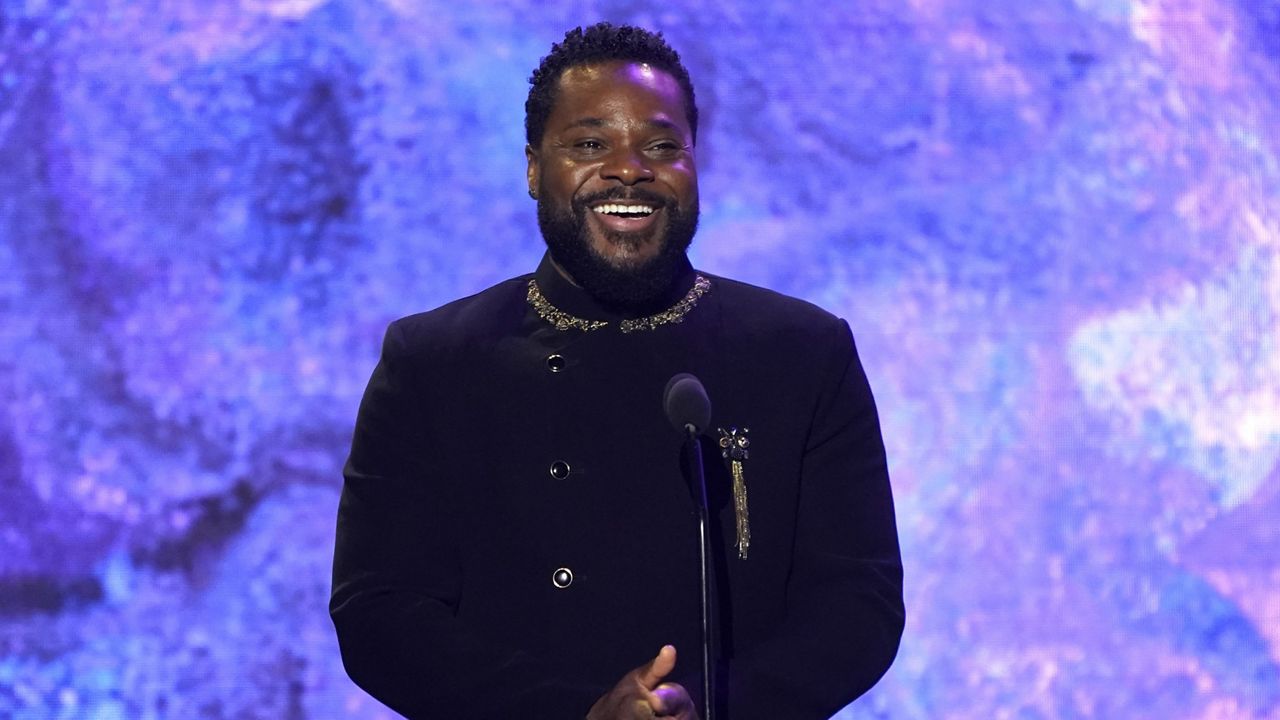 Malcolm-Jamal Warner speaks on stage at the 65th annual Grammy Awards on Feb. 5, 2023, in Los Angeles. (AP Photo/Chris Pizzello)