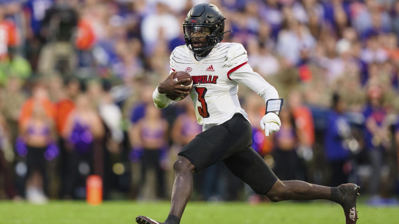 Louisville quarterback Malik Cunningham (3) runs with the ball in the first half of an NCAA college football game against Clemson, Saturday, Nov. 12, 2022, in Clemson, S.C. (AP Photo/Jacob Kupferman)