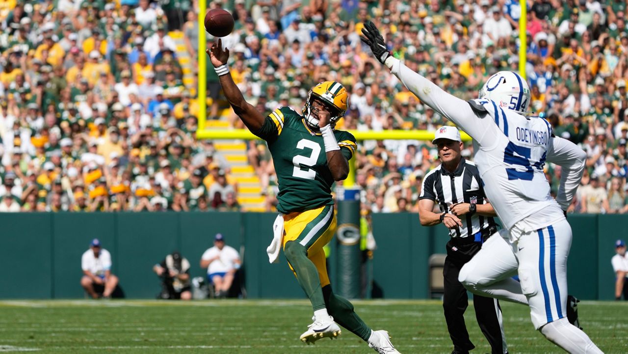 Green Bay Packers quarterback Malik Willis (2) throws on the run as Indianapolis Colts defensive end Dayo Odeyingbo