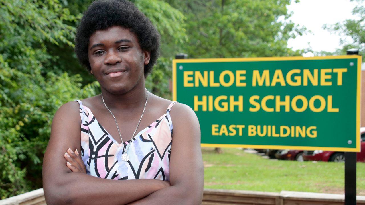Graduating senior from Enloe High School Malika Mobley has concerns about proposed increases in police presence in schools following the recent Texas school shooting, Thursday, June 3, 2022, in Raleigh, N.C. To reassure students and educators following the mass shooting at a Texas elementary school, districts around the country pledged to boost security measures and increased the presence of law enforcement on campus. (AP Photo/Chris Seward)