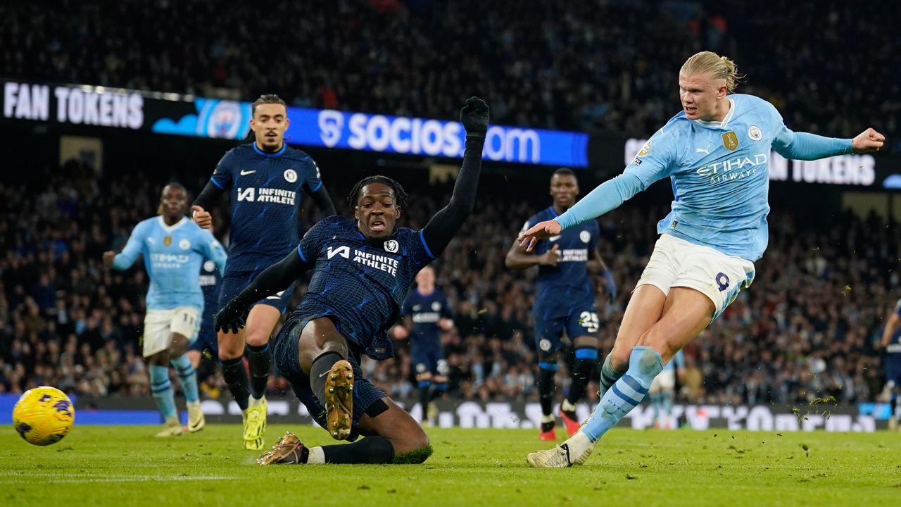 Manchester City's Erling Haaland, right, misses a chance to score as Chelsea's Axel Disai challenges during the English Premier League soccer match between Manchester City and Chelsea at the Etihad stadium in Manchester, England, Saturday, Feb. 17, 2024.