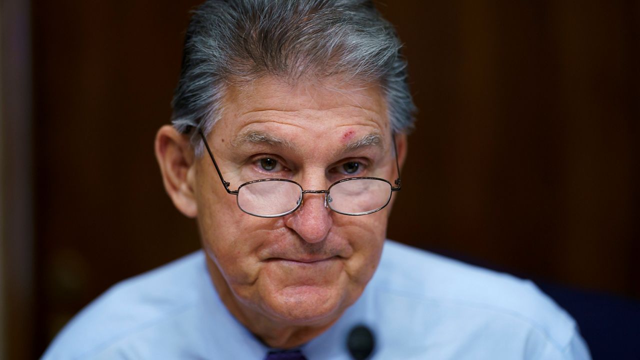 In this Aug. 5, 2021, file photo Sen. Joe Manchin, D-W.Va., prepares to chair a hearing in the Senate Energy and Natural Resources Committee, as lawmakers work to advance the $1 trillion bipartisan bill in Washington. (AP Photo/J. Scott Applewhite, File)
