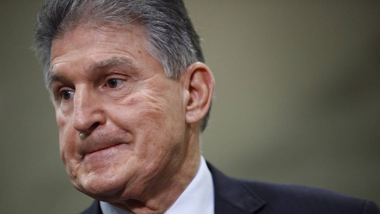 FILE - In this file photo, Sen. Joe Manchin, D-W.Va., speaks with reporters on Capitol Hill in Washington. A bipartisan group of lawmakers, including Manchin, introduced a new proposal for COVID-19 economic relief Monday. (AP Photo/Patrick Semansky, File)