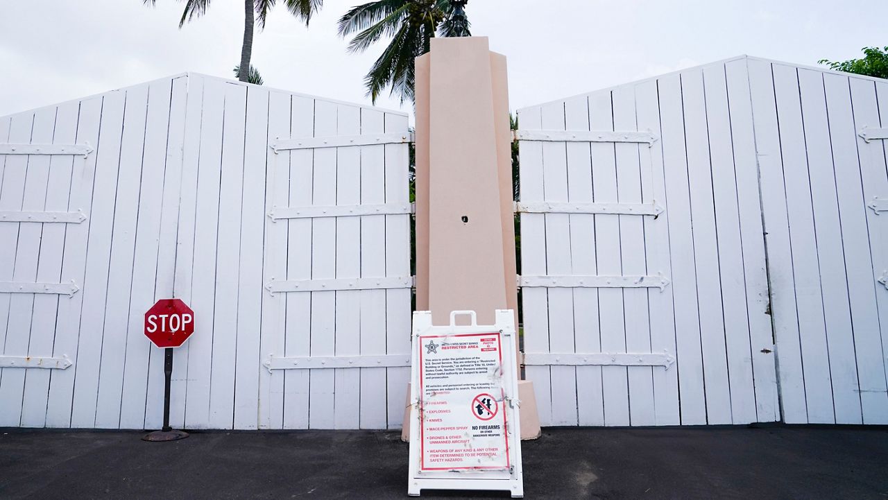 A gate is closed at the entrance to former President Donald Trump's Mar-a-Lago estate, Tuesday, Aug. 9, 2022, in Palm Beach, Fla. (AP Photo/Lynne Sladky)