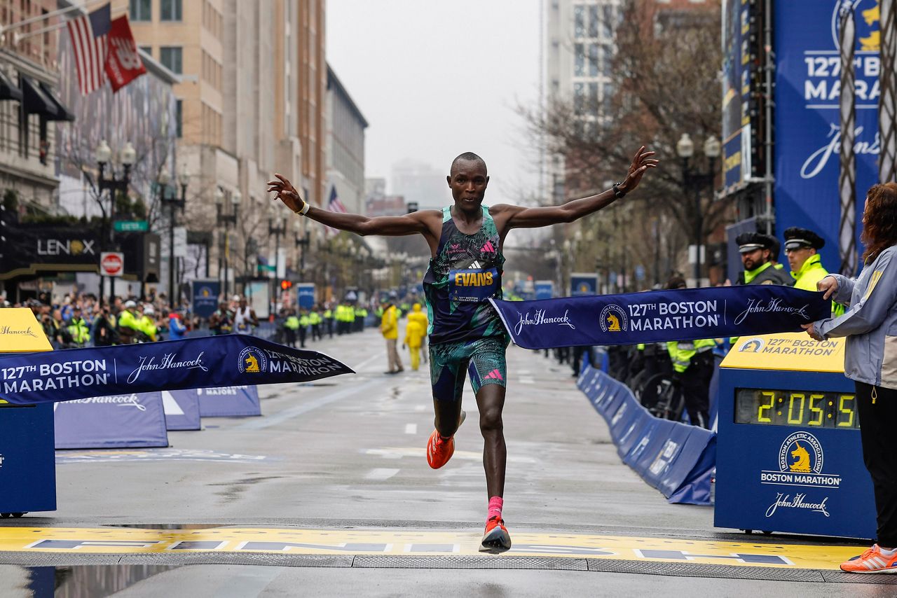 Evans Chebet of Kenya breaks the tape to win the 127th Boston Marathon, Monday, April 17, in Boston. (AP Photo/Winslow Townson)