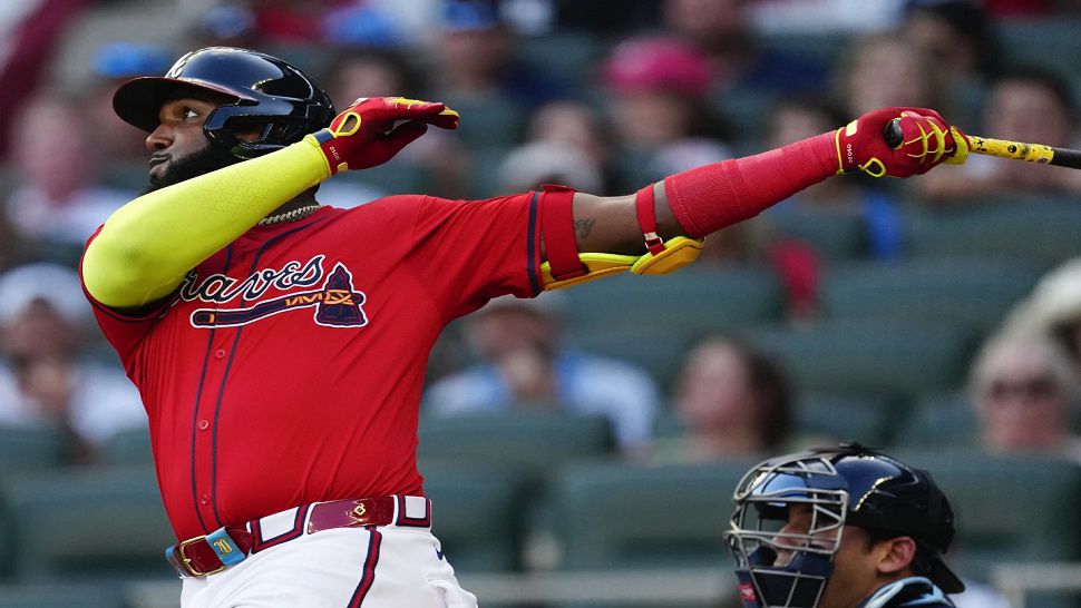 Atlanta Braves designated hitter Marcell Ozuna follows through on a three-run home run in the first inning of a baseball game against the Tampa Bay Rays Friday, June 14, 2024, in Atlanta. (AP Photo/John Bazemore)