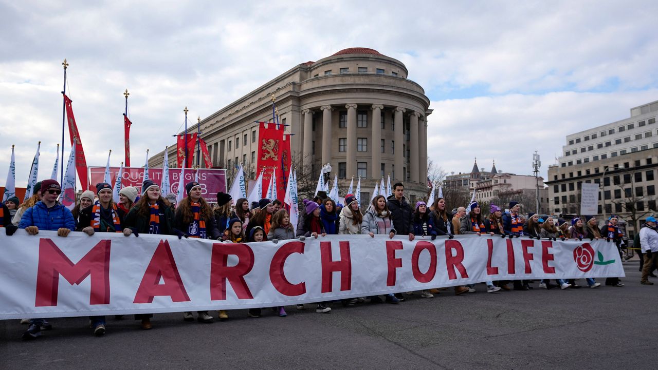 Trump pledges to stand with families at March for Life rally