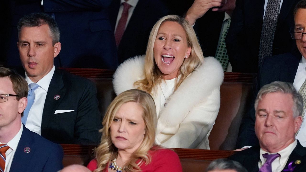 Rep. Majorie Taylor Greene, R-Ga., center, listens and reacts Tuesday night as President Joe Biden delivers his State of the Union speech. (AP Photo/J. Scott Applewhite)