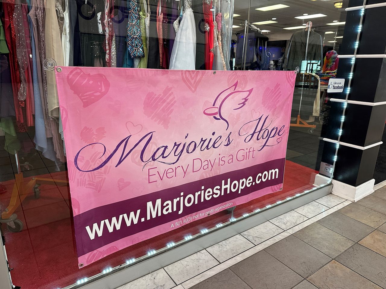 The sign for Marjorie’s Hope hangs in the Gemini Moon Rising shop at Gulf View Square Mall. (Spectrum News)
