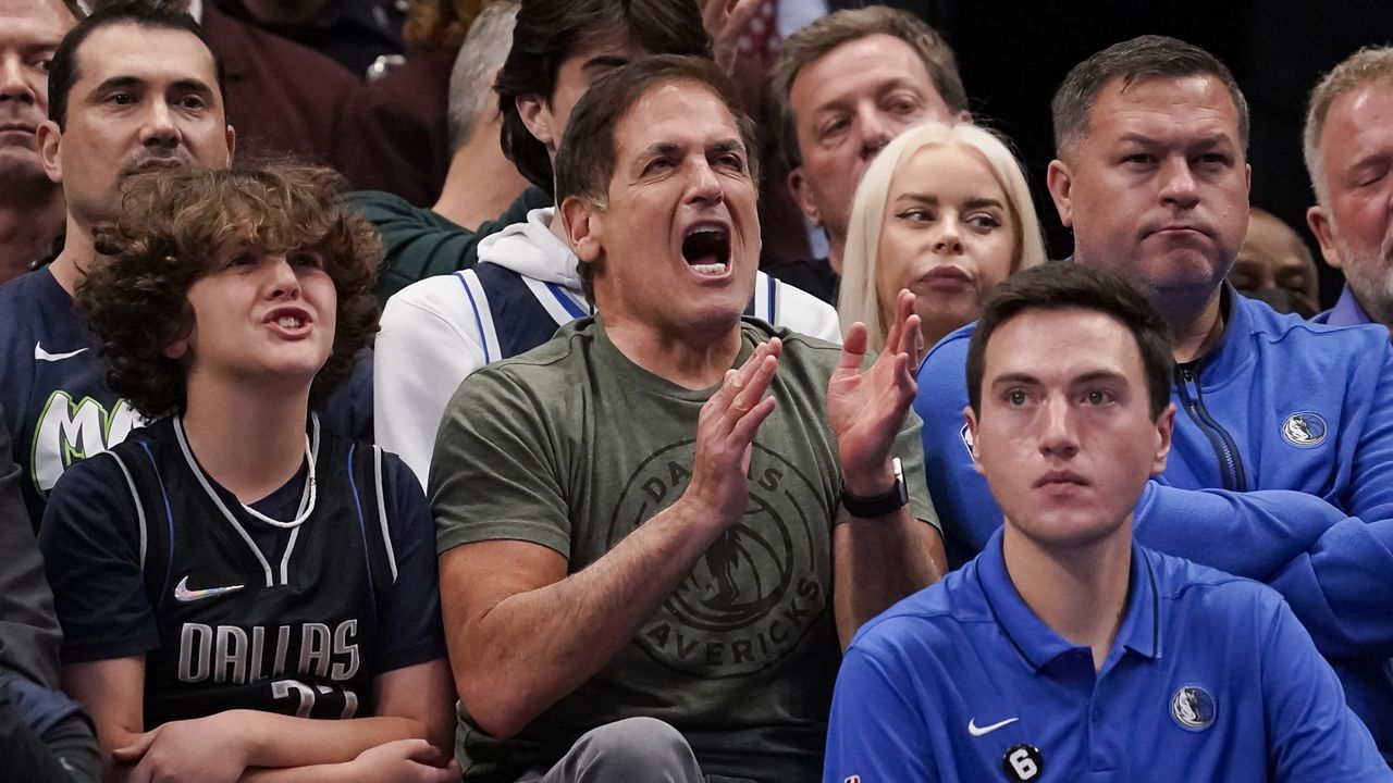 Dallas Mavericks owner Mark Cuban cheers during the first half of the tema's NBA basketball game against the Sacramento Kings in Dallas, Wednesday, April 5, 2023. (AP Photo/Sam Hodde)