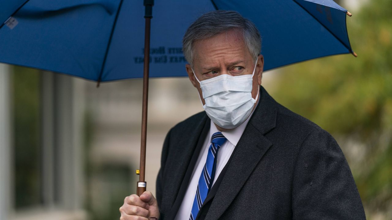 White House chief of staff Mark Meadows responds to reporters questions on the North Lawn of the White House on Sunday. (AP Photo/Manuel Balce Ceneta)