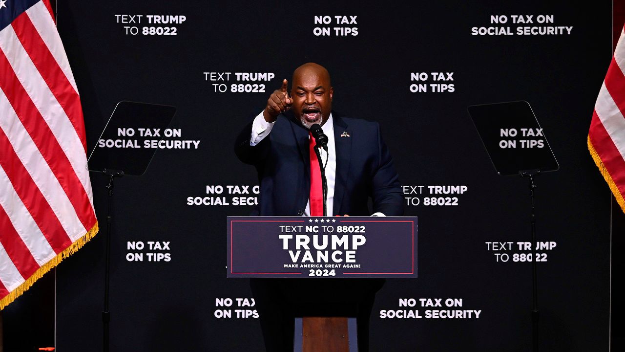 North Carolina Republican gubernatorial candidate Lt. Gov. Mark Robinson speaks before Republican presidential nominee former president Donald Trump in Asheville, N.C., Aug. 14, 2024. (AP File Photo/Matt Kelley)