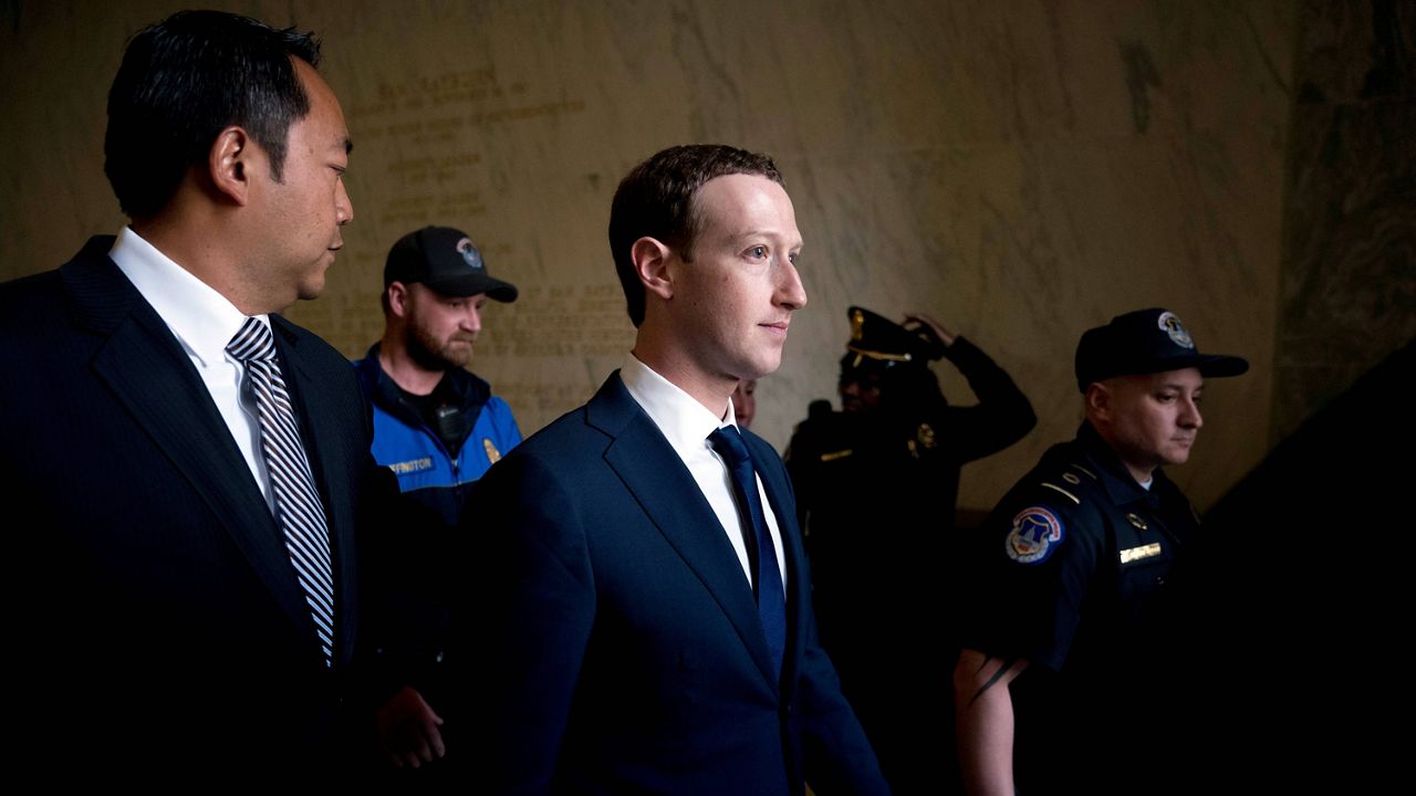 Mark Zuckerberg, chairman and CEO of Facebook, center (AP Photo/Esteban Felix, File)