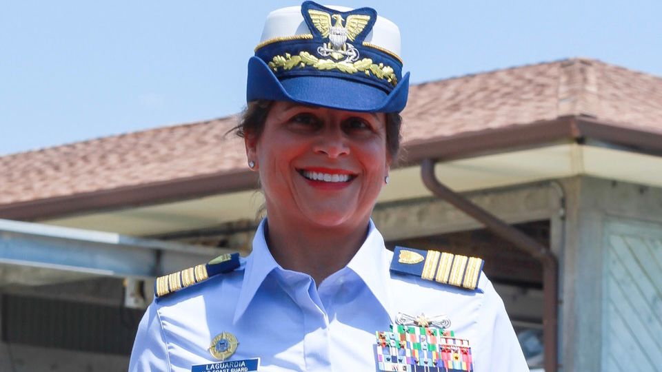 Retired U.S. Coast Guard & award-winning author and speaker smiles in a photo with her military uniform. (Martha LaGuardia-Kotite)