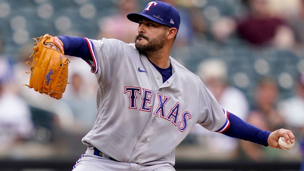 Texas Rangers starting pitcher Martin Perez (54) throws in the first inning of a baseball game against the New York Mets, Saturday, July 2, 2022, in New York. (AP Photo/John Minchillo)