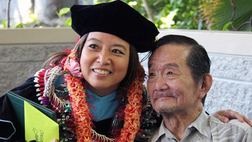 Mary Therese Hattori and her dad, Paul Hattori, on the day of her doctoral graduation at the University of Hawaii at Manoa. (Photo courtesy of Mary Therese Hattori)