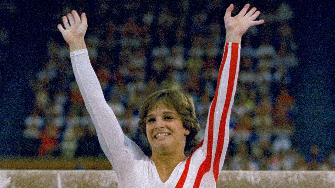 Mary Lou Retton reacts to applause after her performance at the Summer Olympics in Los Angeles on Aug. 3, 1984. Retton. 55, is in intensive care in a Texas hospital fighting a rare form of pneumonia, according to her daughter McKenna Kelley. (AP Photo/Suzanne Vlamis, File)