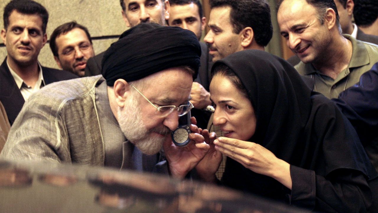 In this July 13, 2005, file photo, outgoing reformist Iranian President Mohammad Khatami talks on the phone with the mother of female journalist Masih Alinejad, right, after meeting with journalists in Tehran, Iran. Federal prosecutors in New York charged a man last week with driving around Alinejad’s Brooklyn neighborhood over the weekend with a loaded assault rifle and dozens of rounds of ammunition. (AP Photo/Hasan Sarbakhshian, File)