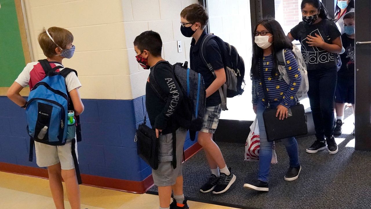 Students wearing masks. (AP Images)