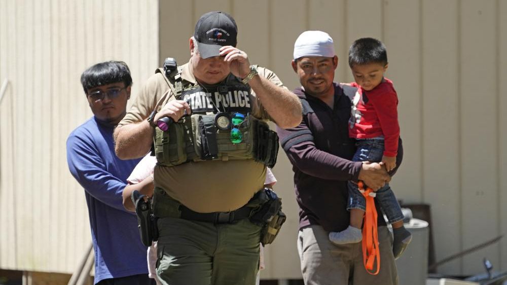 A law enforcement official works Sunday, April 30, 2023, in the neighborhood where a mass shooting occurred Friday night, in Cleveland, Texas. The search for a man who allegedly shot his neighbors after they asked him to stop firing off rounds in his yard stretched into a second day Sunday, with authorities saying the man could be anywhere by now. Francisco Oropesa, 38, fled after the shooting Friday night that left several people dead, including a young boy. (AP Photo/David J. Phillip)