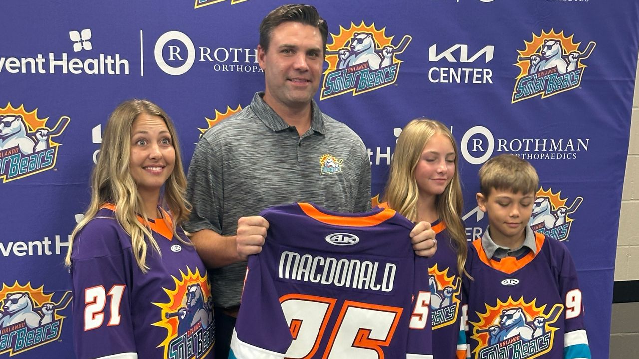 New Solar Bears' head coach Matt MacDonald (Center) poses with his family (from left to right: His wife, Erin, daughter Hazel, and son, Max).
