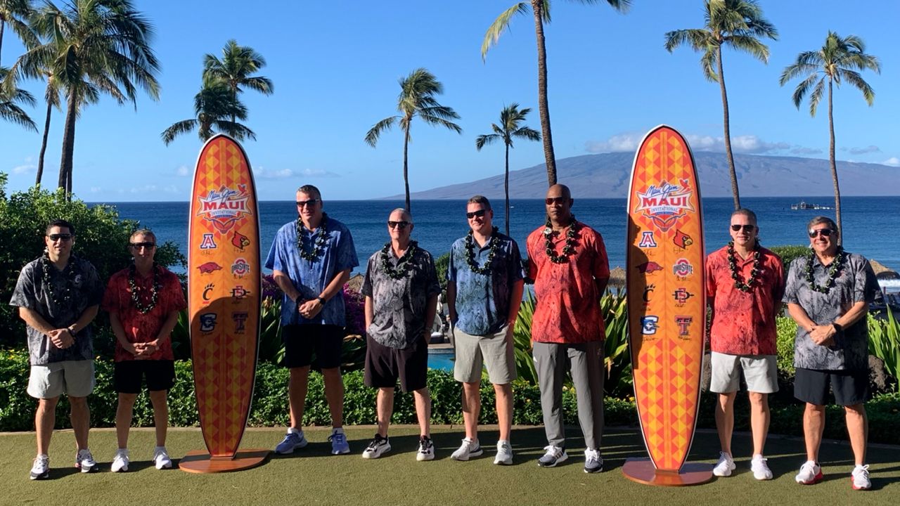 The coaches of the eight teams in the 2022 Maui Jim Maui Invitational posed at the Hyatt Regency Maui with the island of Lanai as a backdrop. From left to right: Wes Miller, Cincinnati; Eric Musselman, Arkansas; Greg McDermott, Creighton; Brian Dutcher, San Diego State; Tommy Lloyd, Arizona; Kenny Payne, Louisville; Chris Holtmann, Ohio State; and Mark Adams, Texas Tech.