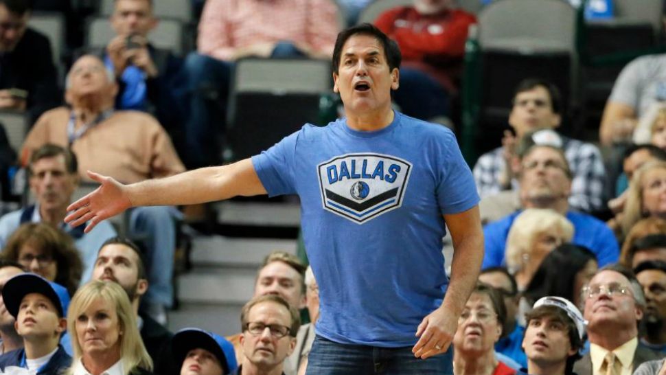 FILE - In this Dec. 14, 2015, file photo, Dallas Mavericks team owner Mark Cuban shouts in the direction of an official during an NBA basketball game against the Phoenix Suns, in Dallas. The Mavericks have hired outside counsel to investigate allegations of inappropriate conduct by former team president Terdema Ussery in a Sports Illustrated report that described a hostile workplace for women. Cuban told the magazine that the team was establishing a hotline for counseling and support services for past and current employees. He is mandating sensitivity training for all employees, himself included. (Tony Gutierrez, File/Associated Press)
