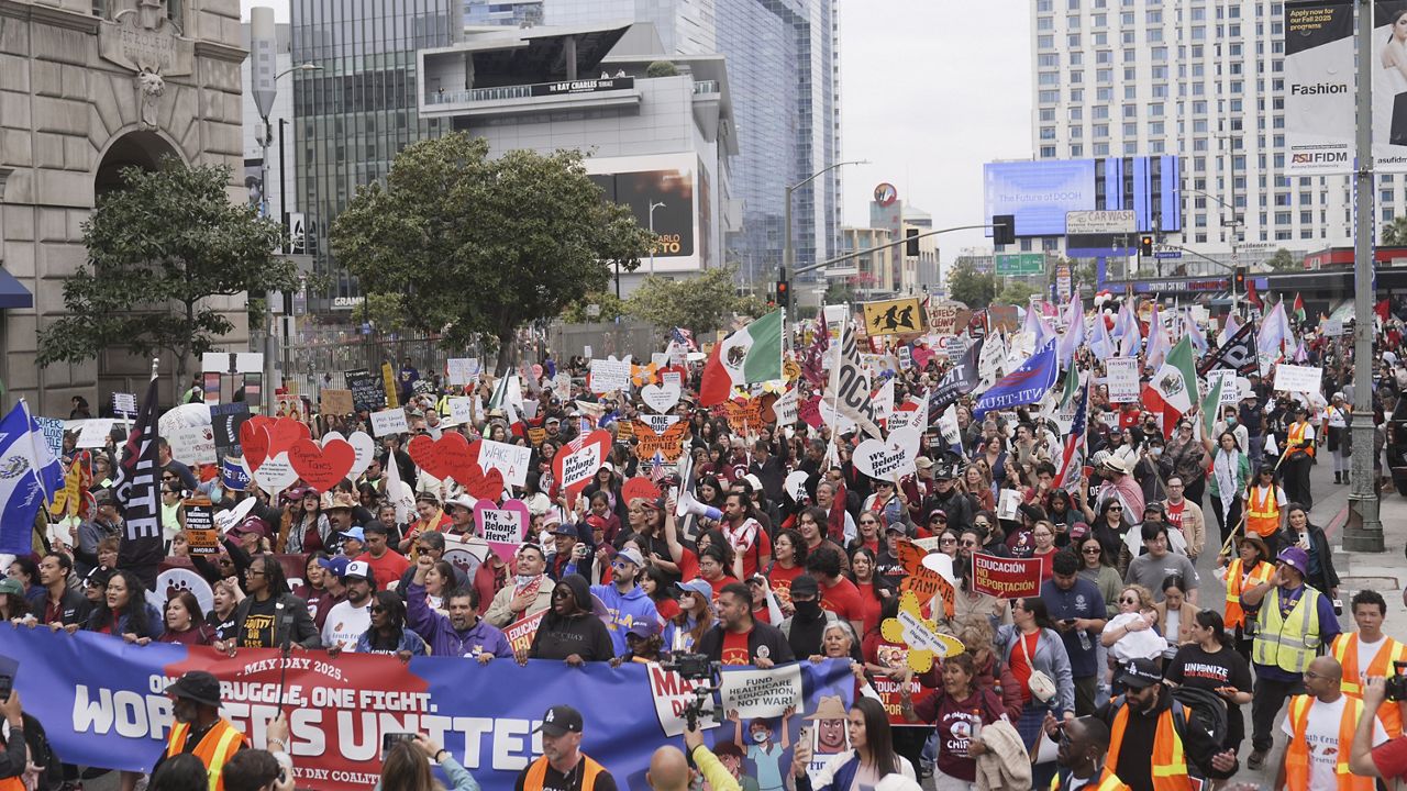 Demonstrators march during a May Day protest Thursday in Los Angeles. (AP Photo/Jae C. Hong)
