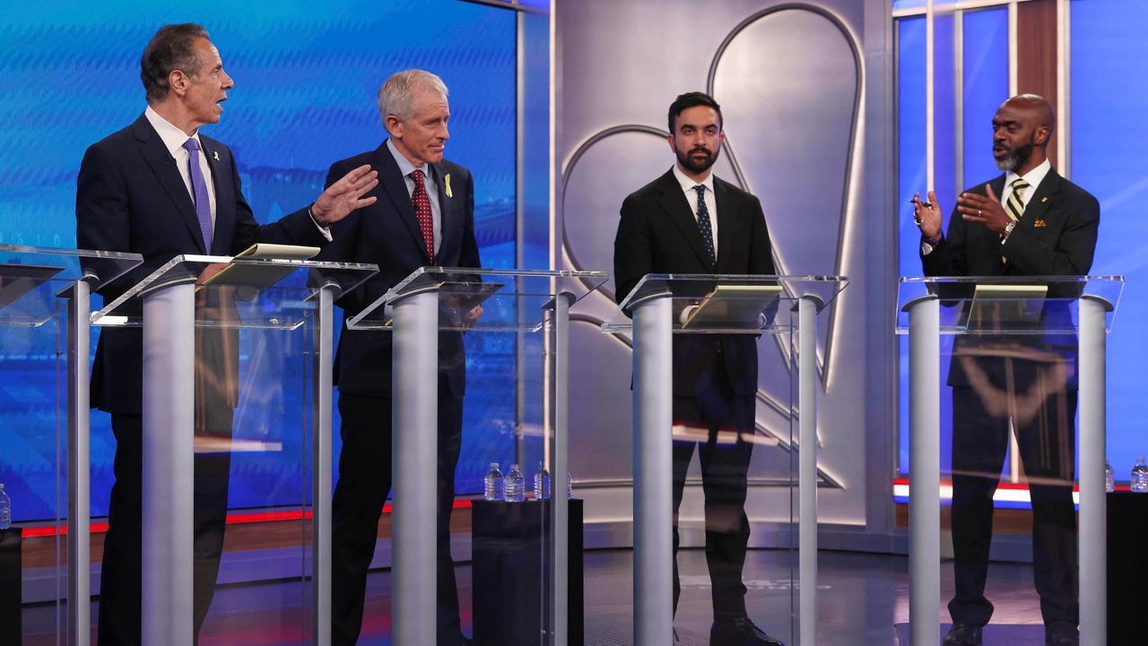 Democratic mayoral candidates Andrew Cuomo, far left, and Michael Blake present arguments as Whitney Tilson, second from left, and Zohran Mamdani look on during a Democratic mayoral primary debate, Wednesday, June 4, 2025, in New York. (AP Photo/Yuki Iwamura, Pool)