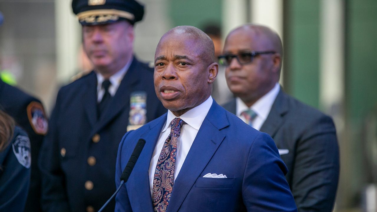 Mayor Eric Adams speaks in New York's Times Square during a news conference on Dec. 30, 2022.