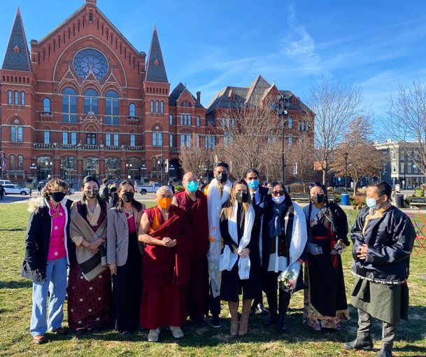 A newly sworn-in Aftab Pureval and family poses with Tenpa Phuntsok and other immigrants from Tibet at Washington Park. (Casey Weldon/Spectrum News 1)