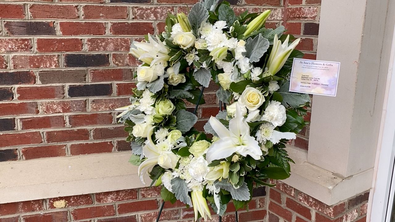 Memorial flowers left for the mayor outside town hall