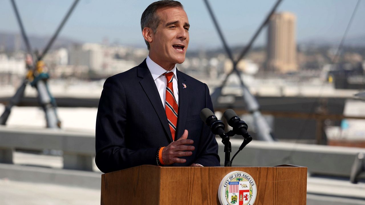 Los Angeles Mayor Eric Garcetti delivers the State of the City Address from the under-construction Sixth Street Viaduct on April 14, 2022, in LA. (Gary Coronado/Los Angeles Times via AP, Pool, File)