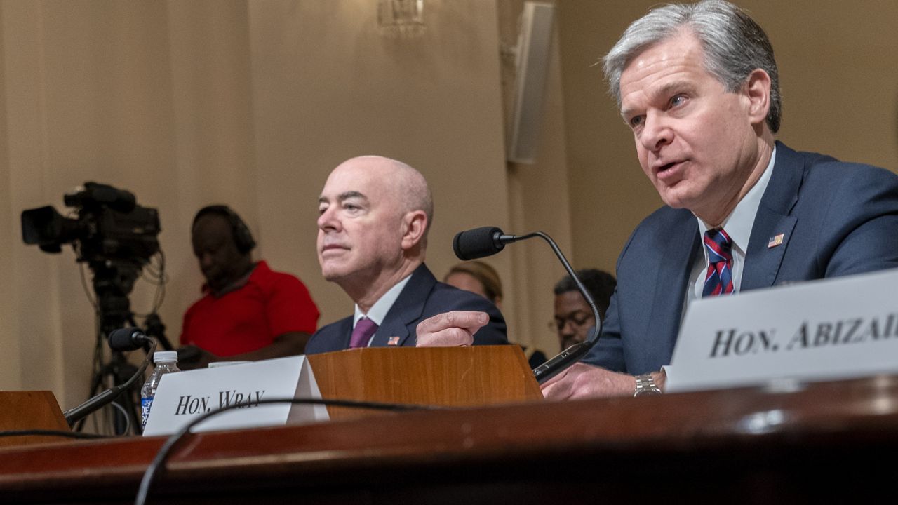 Homeland Security Secretary Alejandro Mayorkas, left, listens as FBI Director Christopher Wray, speaks during a House Committee on Homeland Security hearing on worldwide threats to the United States, Wednesday, Nov. 15, 2023, on Capitol Hill in Washington. (AP Photo/Jacquelyn Martin)