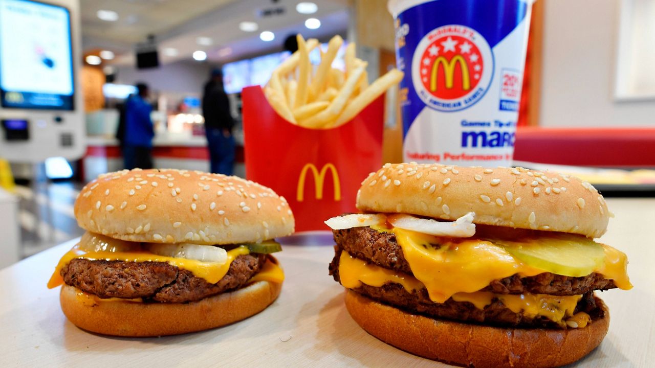 A McDonald's Quarter Pounder, left, and Double Quarter Pound burger (AP Photo/Mike Stewart, File)