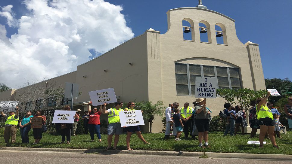 Crowds gathered at the intersection of Haines Road North and 38 Avenue North to protest the Stand Your Ground law in Florida.