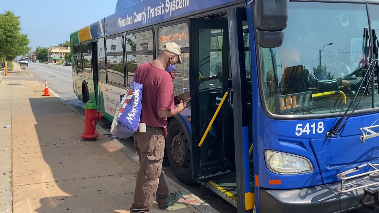rider gets on an mcts bus