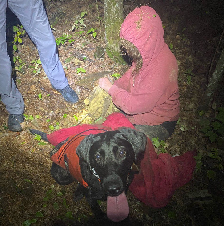 Jennifer Foxlow and Game Warden K9 Luna after Foxlow, missing for 11 hours, was located. (Maine Inland Fish and Wildlife)
