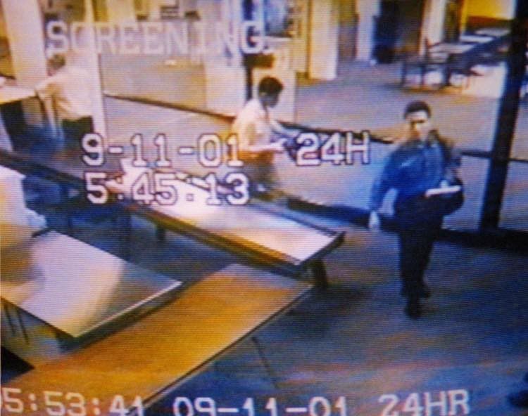 Mohamed Atta, right, and Abdulaziz al-Omari are seen passing through security at the Portland Jetport on the morning of Sept. 11, 2001. 