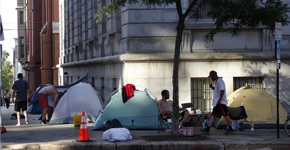 Tents line the sidewalk around City Hall at an encampment in Portland, Maine. (Photo by Robert F. Bukaty/Associated Press).