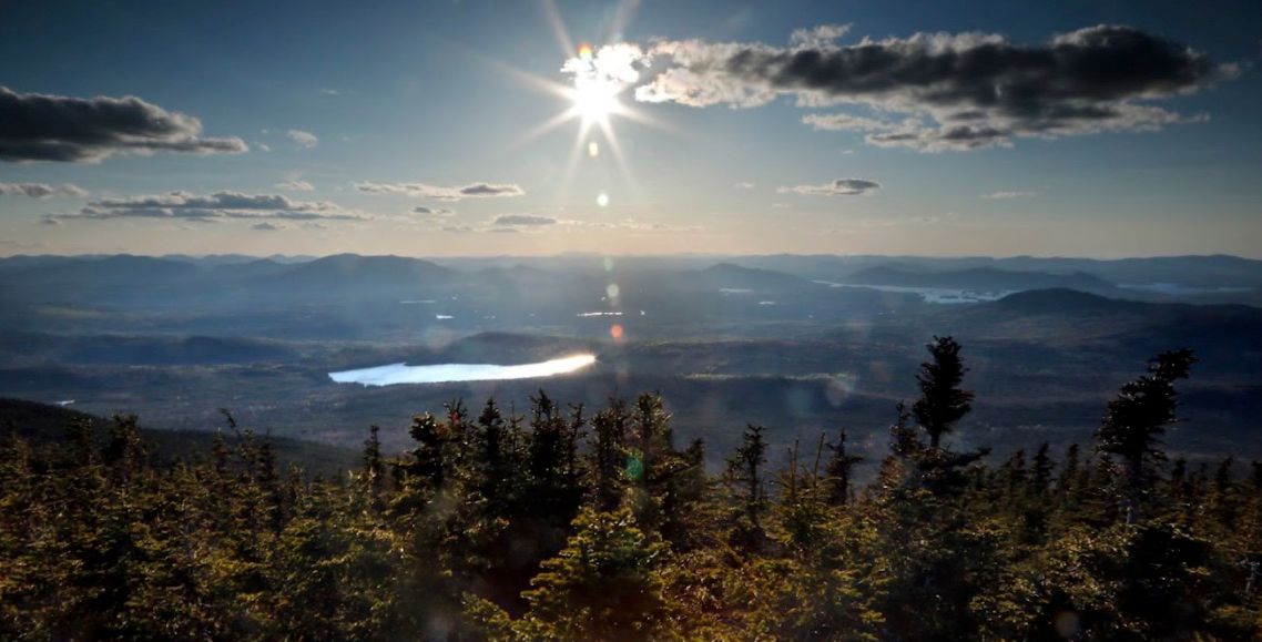 This Monday, May 27, 2019 photo shows a view from Coburn Mountain near Jackman, Maine, where Central Maine Power's controversial hydropower transmission corridor would be cut. It would extend 53 miles from the Canadian border into Maine's north woods. CMP would clear a 150-foot swath of land. (Photo by Robert F. Bukaty/Associated Press)
