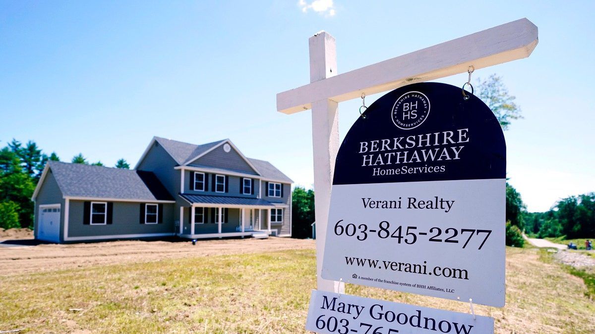 A real estate sign is posted in front of a newly constructed single family home, Thursday, June 24, 2021 in Auburn, N.H. (AP Photo/Charles Krupa)