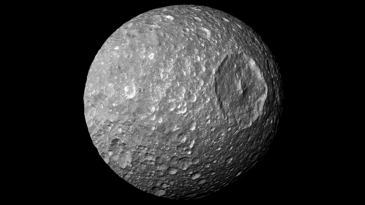 The large crater on Saturn’s moon Mimas makes it resemble the Death Star, in this photo by the NASA spacecraft Cassini. (Photo courtesy of NASA/JPL). 