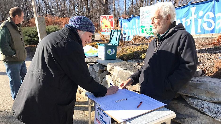 Supporters of the Pine Tree Power plan circulated their petition on Election Day and have been taking it to holiday fairs, markets and other gatherings around the state since then. (Courtesy of Our Power Facebook)