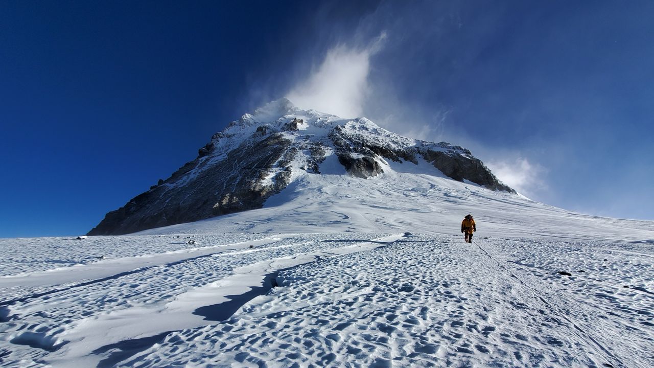  A researcher walks on Mt. Everest’s highest glacier, the South Col, which new UMaine research suggests will disappear within a few decades because of human-caused climate change. (Photo by Mariusz Potocki/University of Maine)