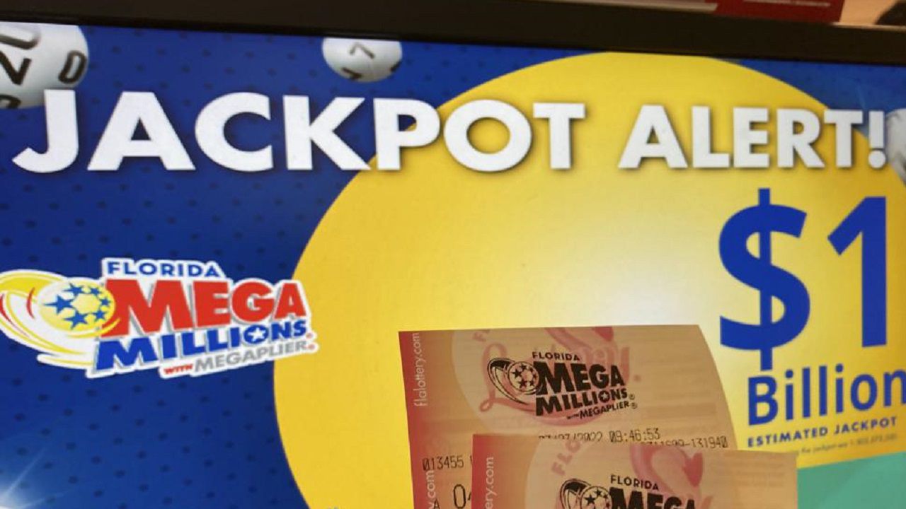 The Mega Millions lottery jackpot is advertised outside a smoke shop Tuesday in the Bushwick neighborhood in the Brooklyn, New York. (AP Photo/John Minchillo)
