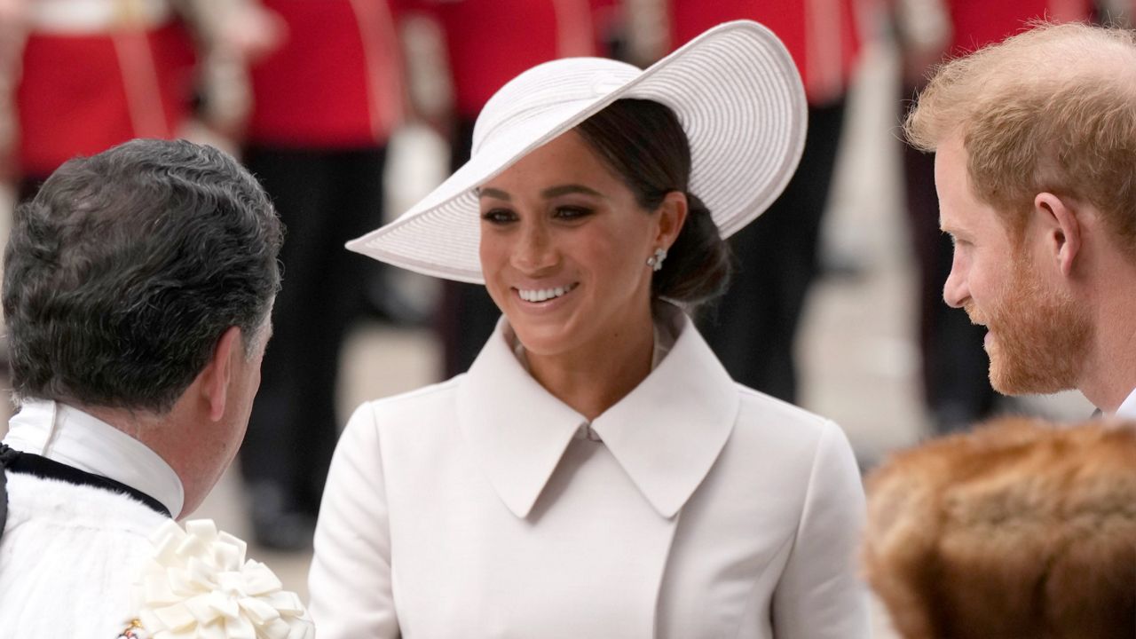 Prince Harry and Meghan Markle, duke and duchess of Sussex, arrive for a service of thanksgiving for the reign of Queen Elizabeth II at St. Paul's Cathedral in London on June 3. (AP Photo/Matt Dunham, Pool)