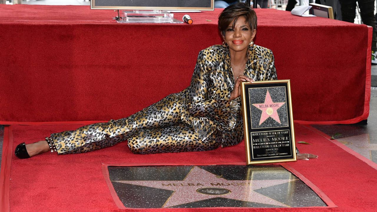 Actress and singer Melba Moore poses with her star on the Hollywood Walk of Fame during a ceremony in her honor on Thursday in Los Angeles. (Photo by Richard Shotwell/Invision/AP)